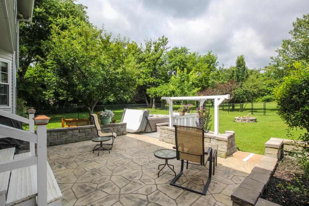 496 Horn Springs Road Lebanon, TN 37087 - Photo 6 of 30 a view of backyard with a table and chairs