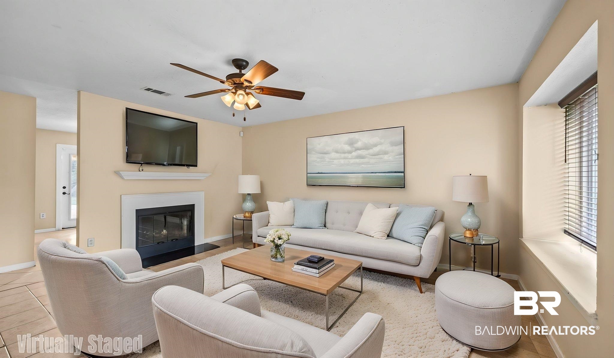15096 Highland Circle Foley, AL 36535 - Photo 8 of 52 Living area featuring a fireplace with a white mantel, an integrated television mount, a ceiling fan with light fixture, and wood-finish flooring