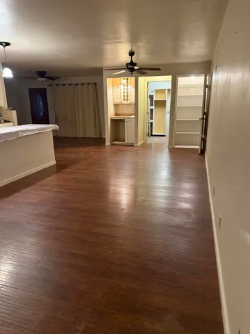 a large kitchen with lots of counter space and stainless steel appliances
