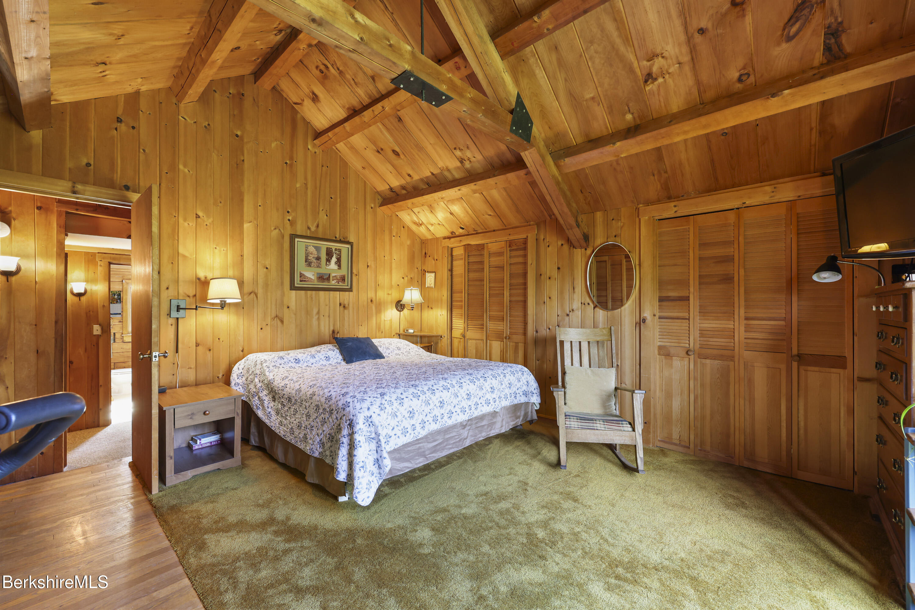 78 East Main Road Peru, MA 01235 - Photo 30 of 56 a spacious bedroom with a bed and a table