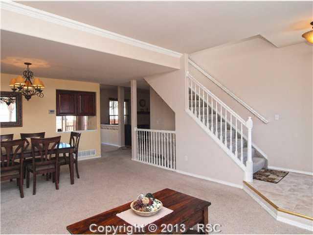 8072 Ferguson Road Peyton, CO 80831 - Photo 3 of 21 View from Family room into the dining room, kitchen and family room.
