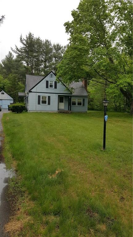 147 Willimantic Road Chaplin, CT 06235 - Photo 1 of 1 a front view of a house with a garden