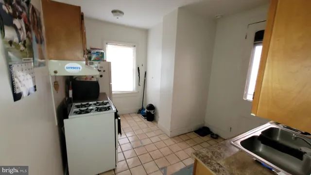 a bedroom with a bed and a stove top oven
