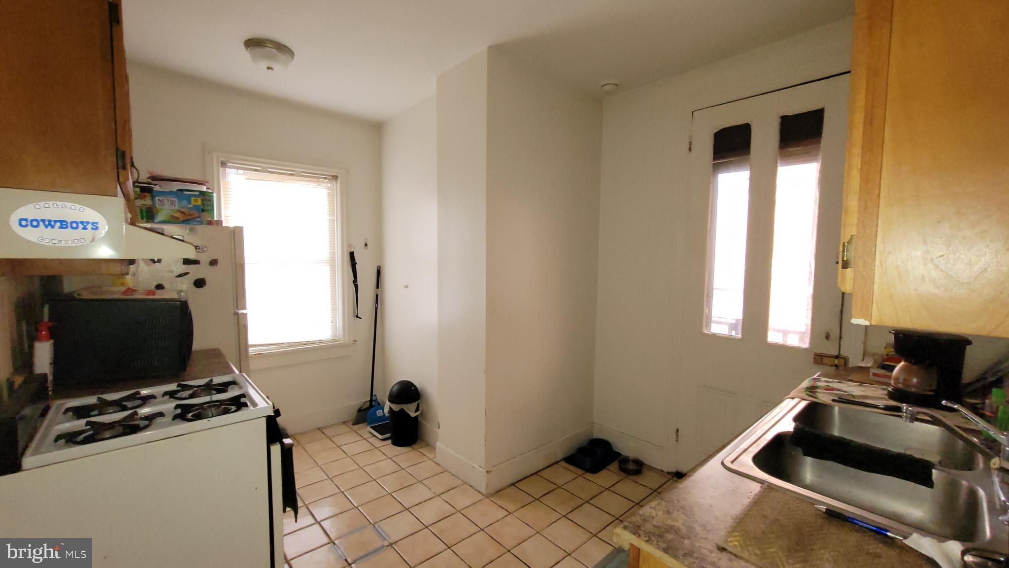 146 North 5th Street Reading, PA 19601 - Photo 15 of 53 a room with furniture and a flat screen tv