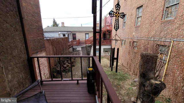 a view of a livingroom with furniture and a window