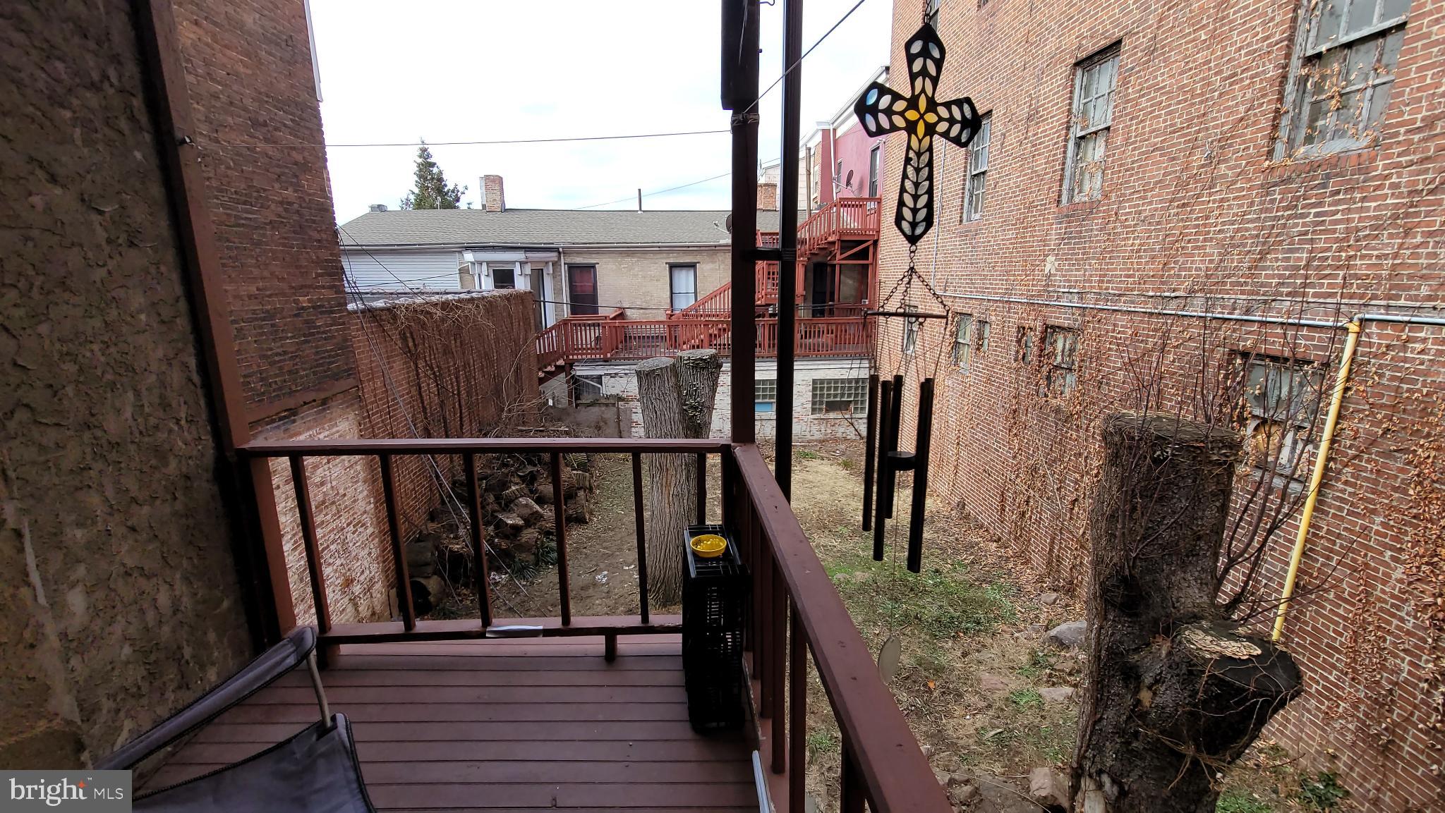 146 North 5th Street Reading, PA 19601 - Photo 19 of 53 a view of balcony with wooden floor and bench