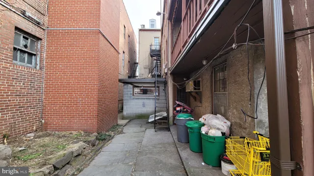 a view of path along with brick wall