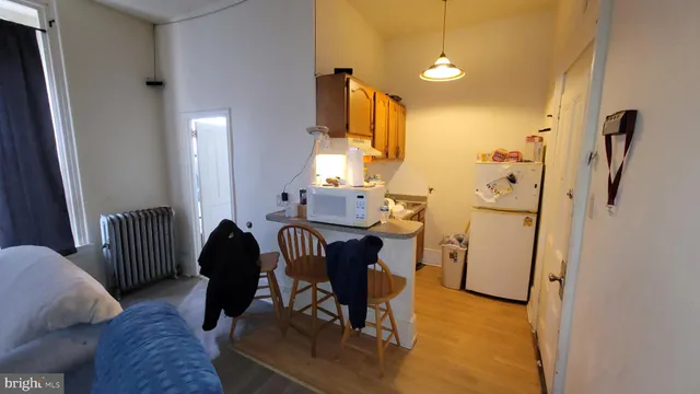 a bedroom with furniture and a fireplace