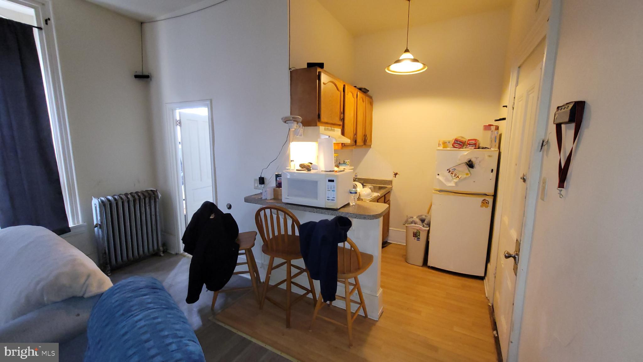 146 North 5th Street Reading, PA 19601 - Photo 21 of 53 a view of a livingroom with furniture and a window