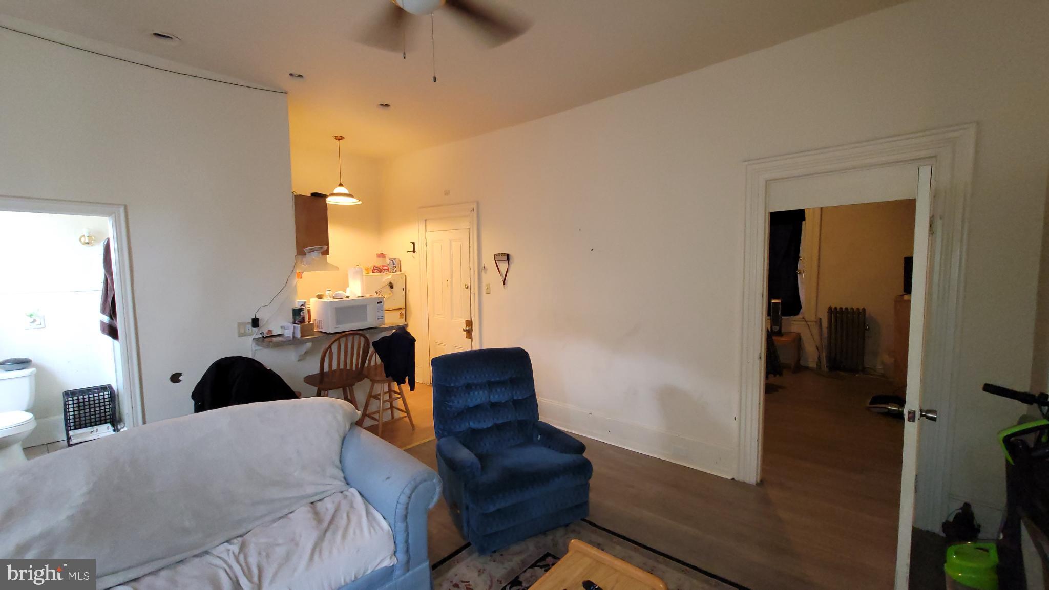 146 North 5th Street Reading, PA 19601 - Photo 22 of 53 a bedroom with a bed and a couch