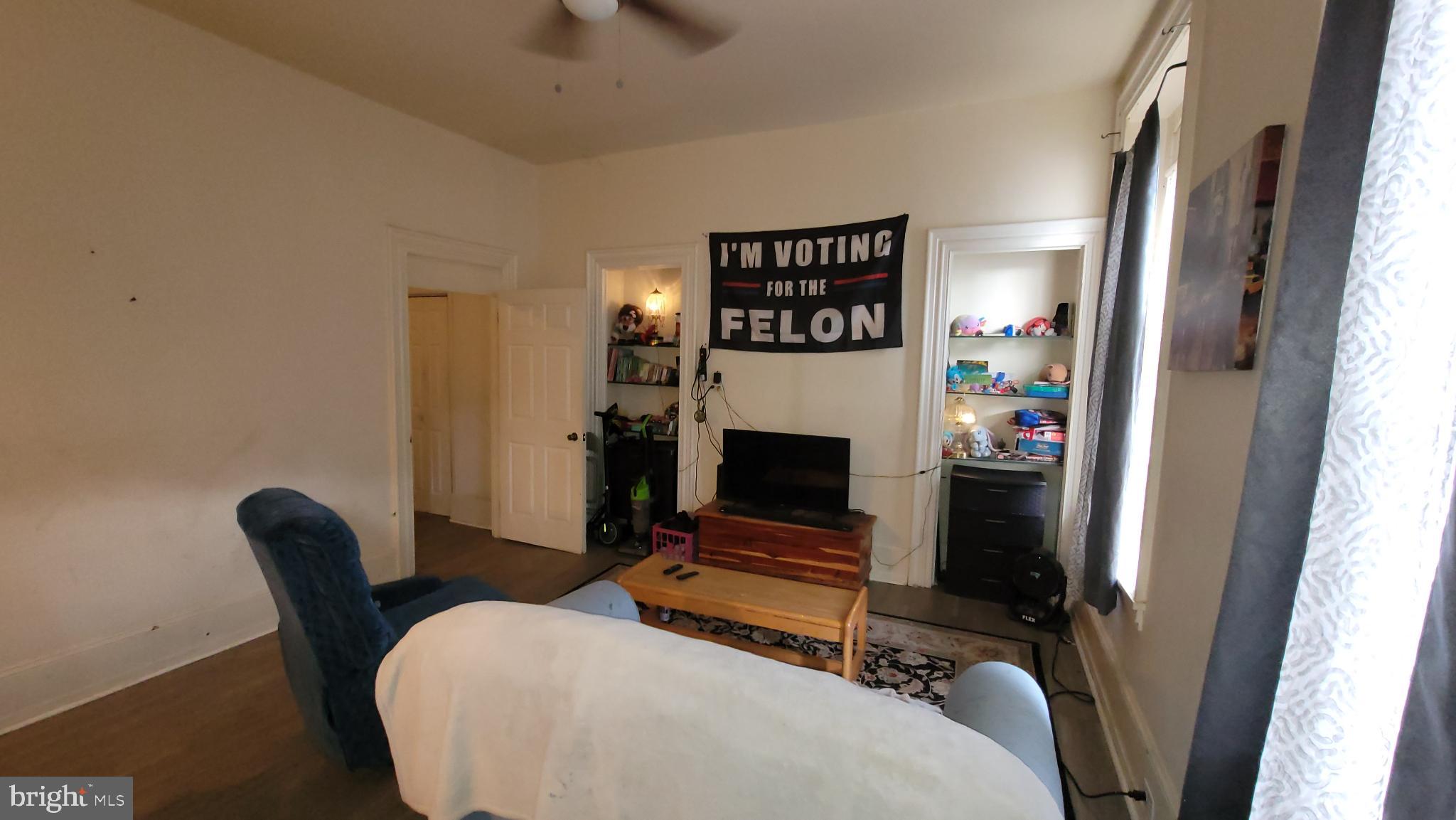 146 North 5th Street Reading, PA 19601 - Photo 23 of 53 a bedroom with furniture and a fireplace