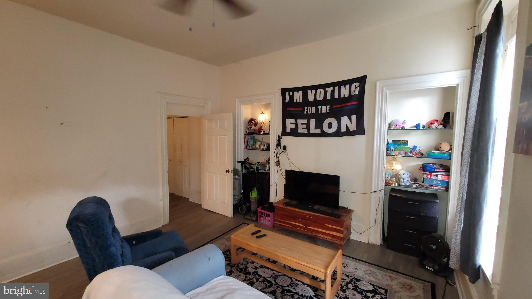 146 North 5th Street Reading, PA 19601 - Photo 25 of 53 a living room with furniture a flat screen tv and a fireplace