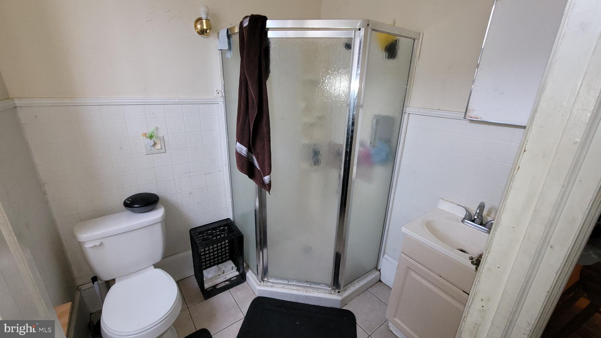 146 North 5th Street Reading, PA 19601 - Photo 27 of 53 a white toilet sitting next to a bathroom sink