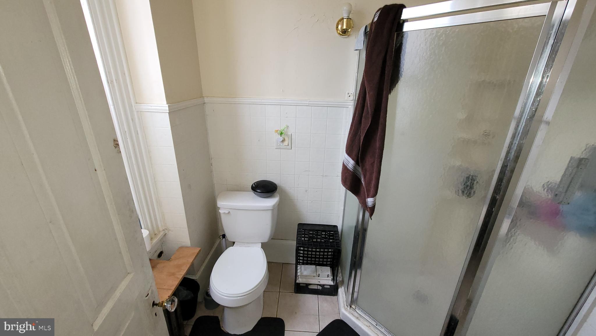 146 North 5th Street Reading, PA 19601 - Photo 28 of 53 a bathroom with a toilet and a shower