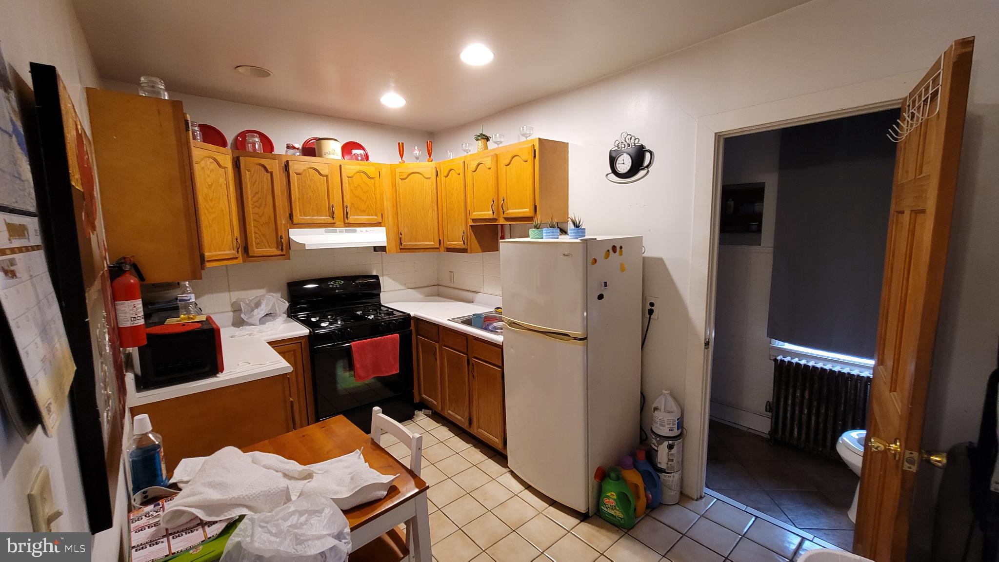 146 North 5th Street Reading, PA 19601 - Photo 37 of 53 a kitchen with refrigerator and window
