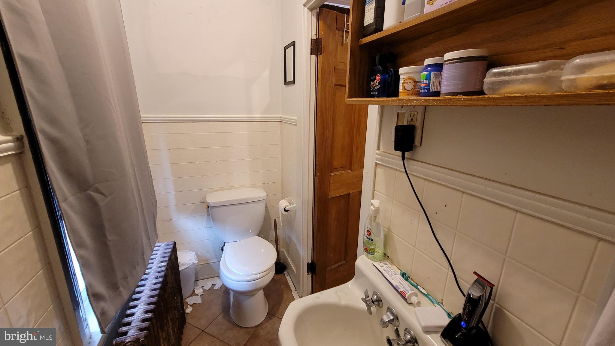 146 North 5th Street Reading, PA 19601 - Photo 39 of 53 a bathroom with a toilet and a shower