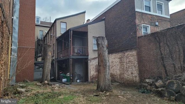 a view of a house with a yard and garage