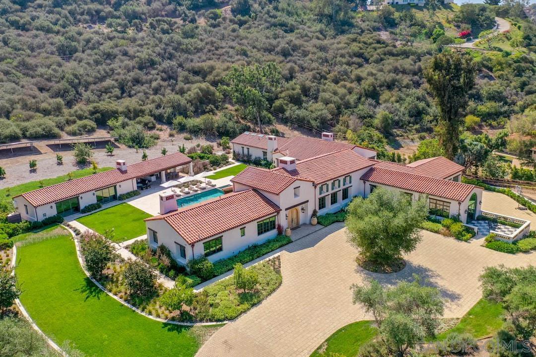 an aerial view of a house with a garden