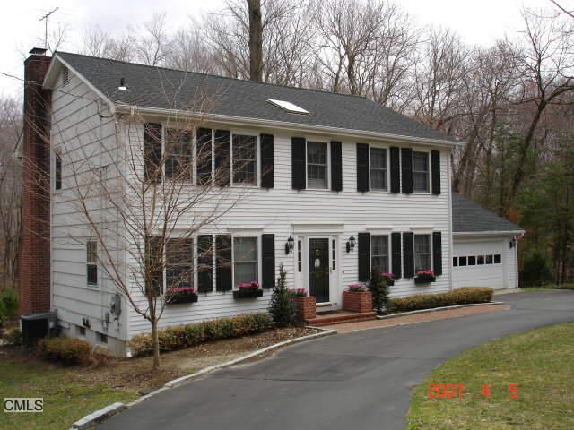 54 High Point Road Westport, CT 06880 - Photo 1 of 1 a front view of a house with a garden