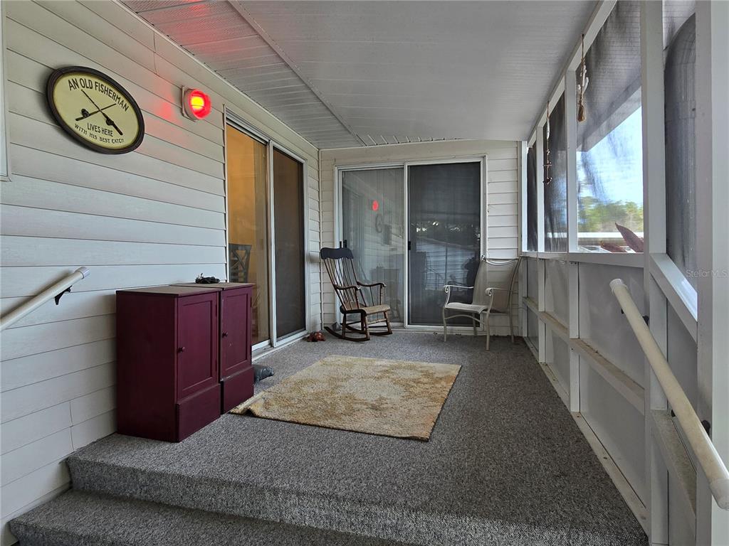 24521 Alligator Road Astor, FL 32102 - Photo 14 of 18 a view of a hallway with entryway and front door