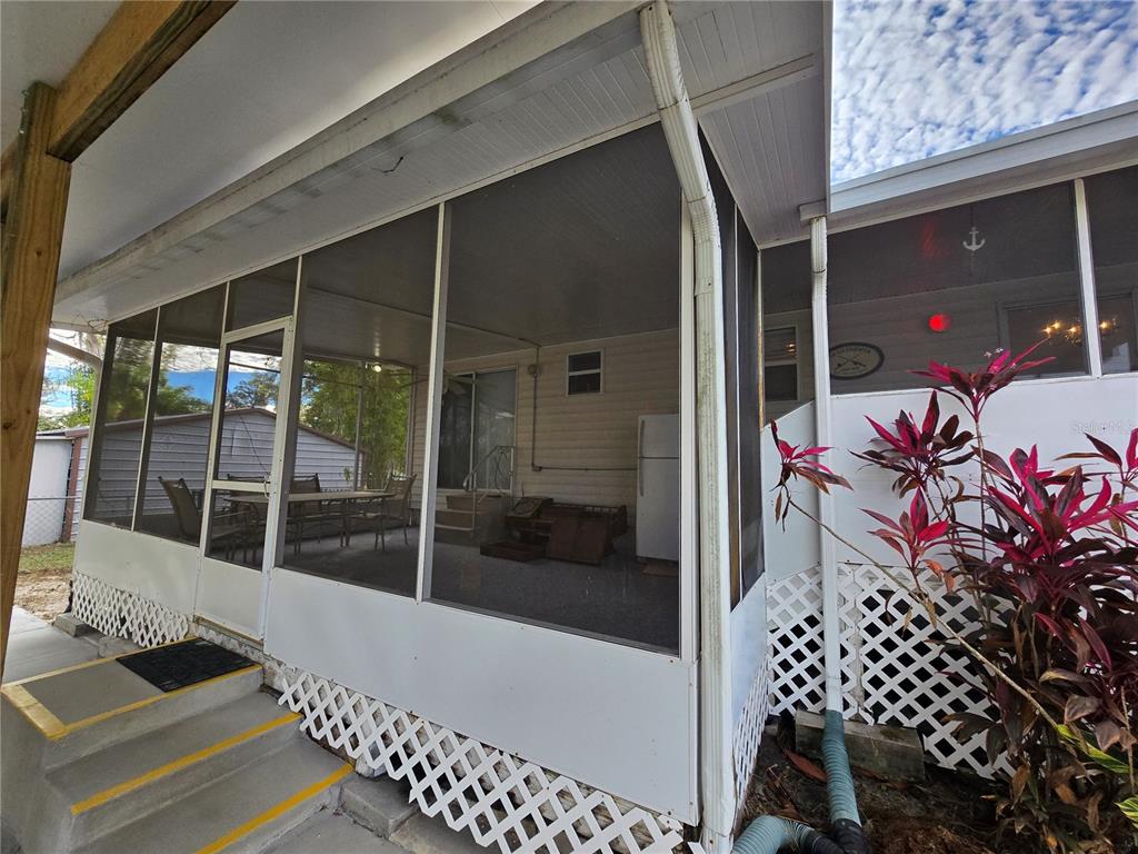 24521 Alligator Road Astor, FL 32102 - Photo 16 of 18 a outdoor space with a balcony