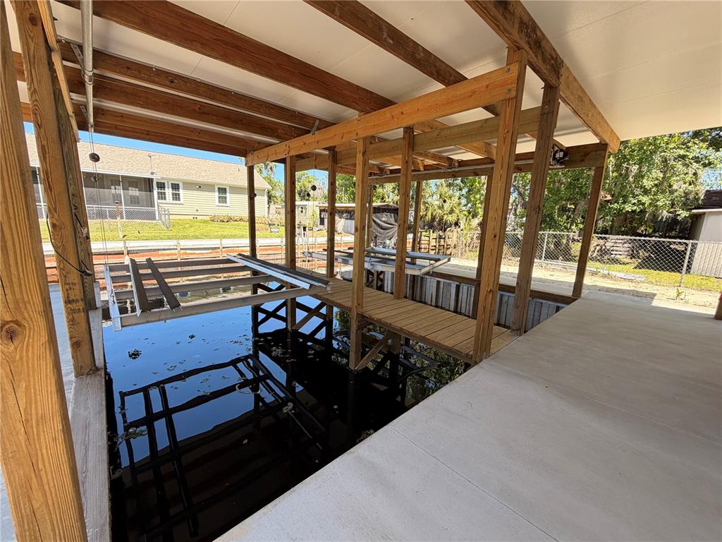 24521 Alligator Road Astor, FL 32102 - Photo 16 of 24 a view of a porch and garden