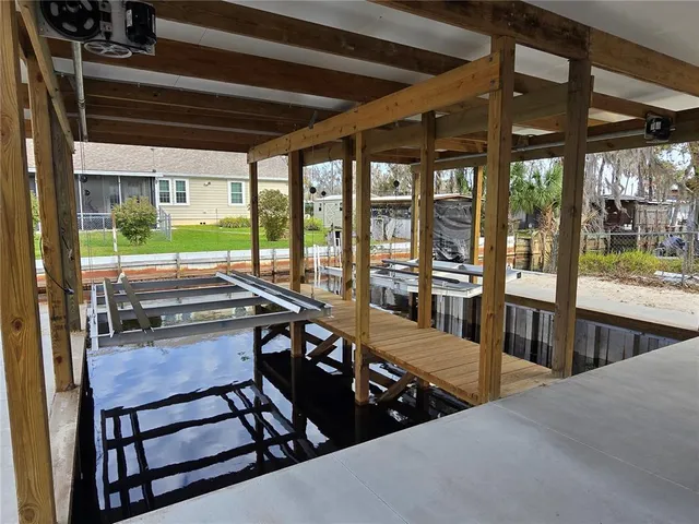 a sitting area with furniture and wooden floor