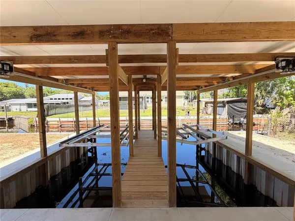 a view of house with outdoor space and swimming pool