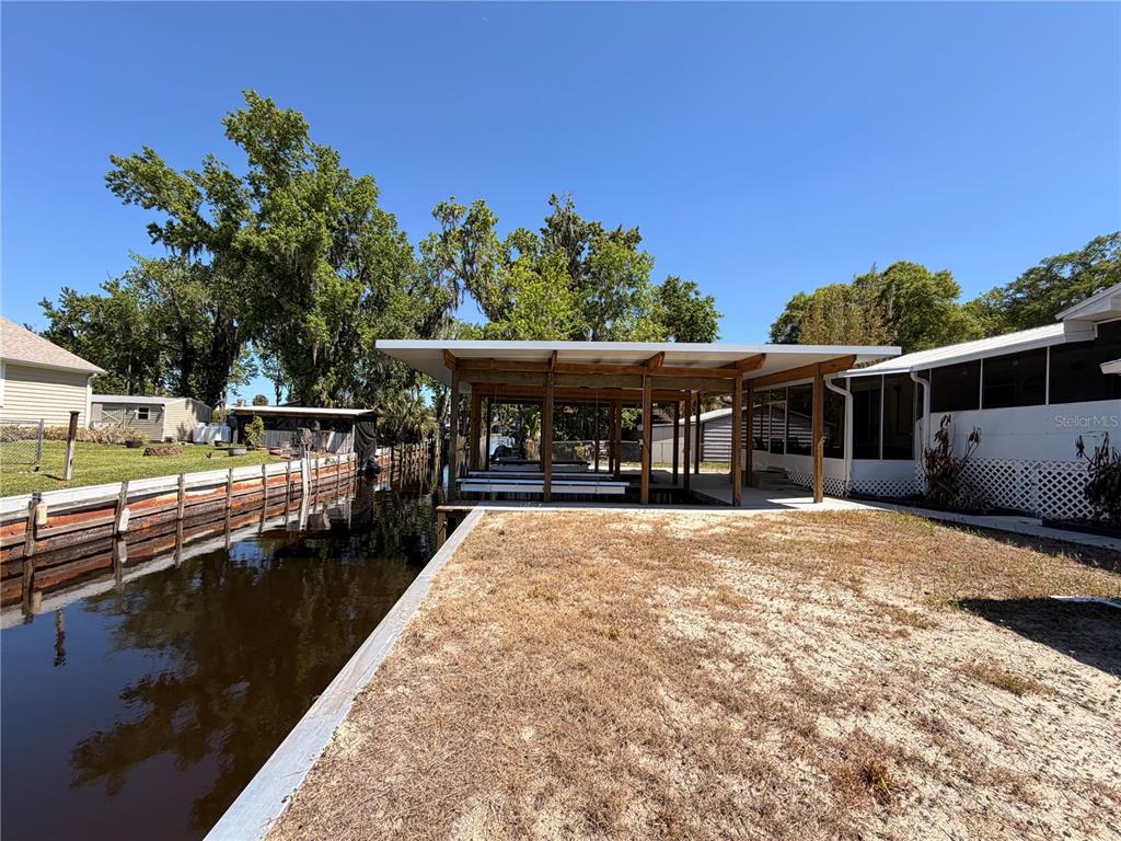 24521 Alligator Road Astor, FL 32102 - Photo 24 of 24 a view of house with outdoor space and swimming pool