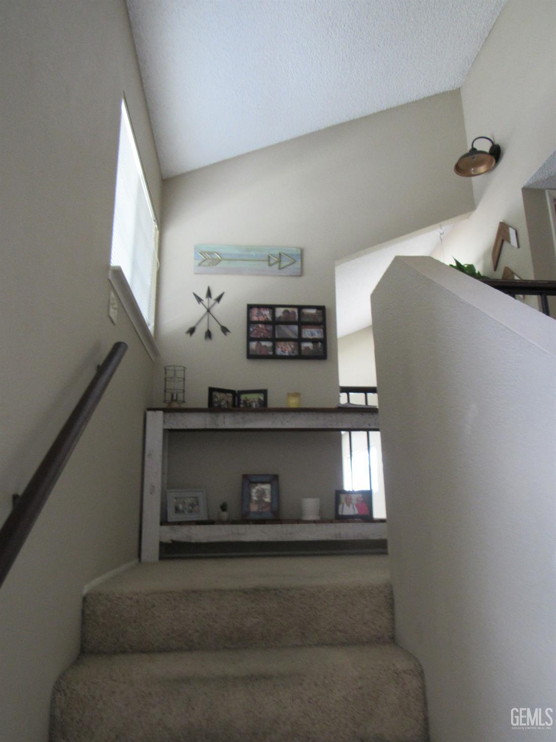 Undisclosed Address Bakersfield, CA 93309 - Photo 11 of 25 a living room with furniture and a fireplace