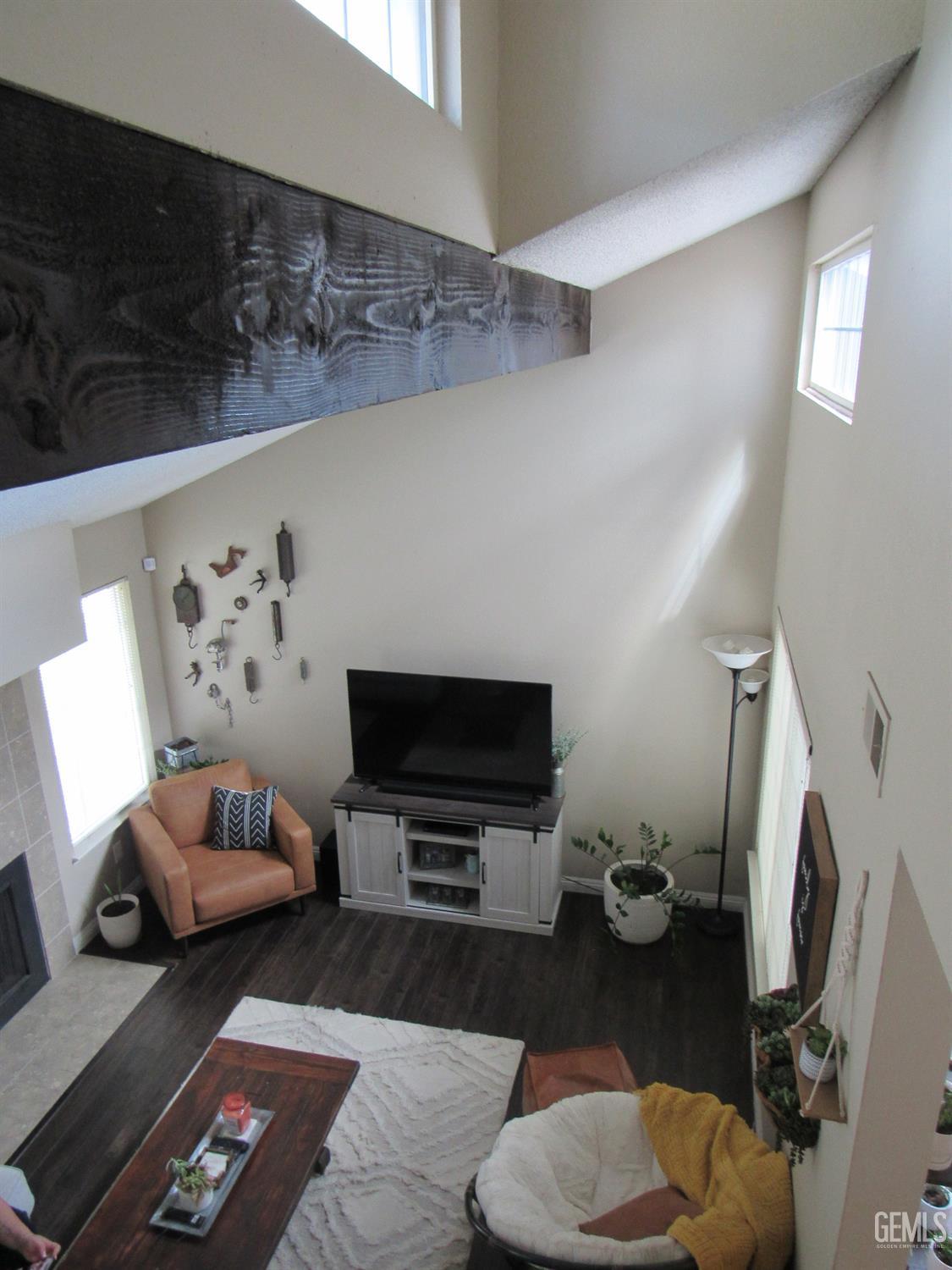 Undisclosed Address Bakersfield, CA 93309 - Photo 12 of 25 a living room with furniture and a flat screen tv