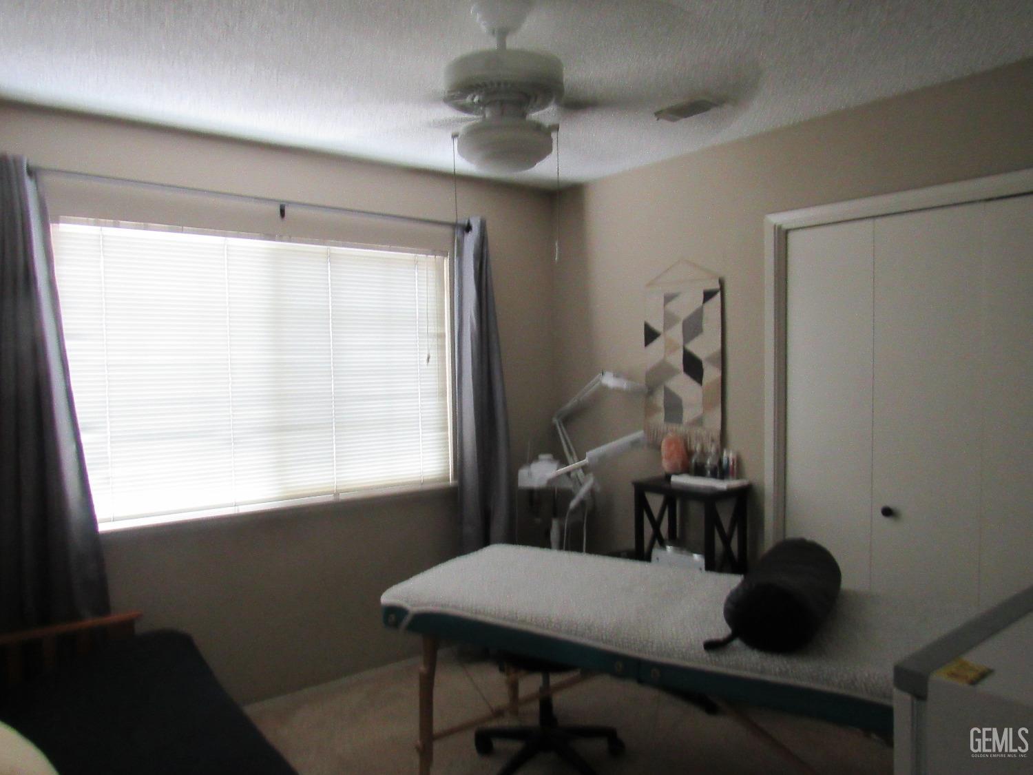 Undisclosed Address Bakersfield, CA 93309 - Photo 17 of 25 a room with a window and furniture