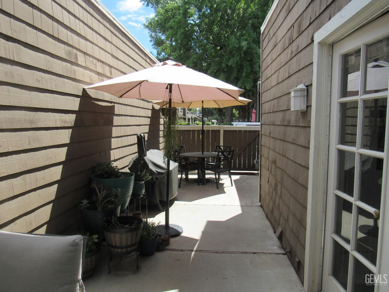 Undisclosed Address Bakersfield, CA 93309 - Photo 20 of 25 a view of a patio with chairs and a barbeque