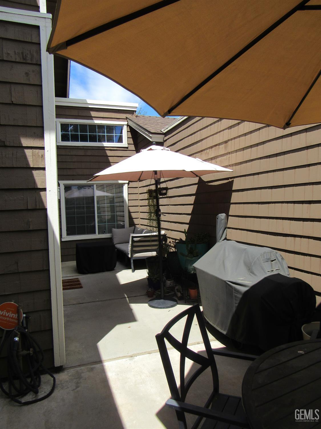 Undisclosed Address Bakersfield, CA 93309 - Photo 21 of 25 a balcony with table and chairs