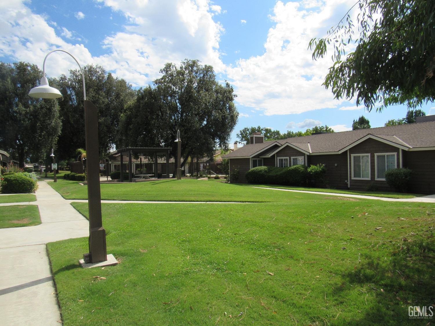 Undisclosed Address Bakersfield, CA 93309 - Photo 22 of 25 a view of green field with house in the background
