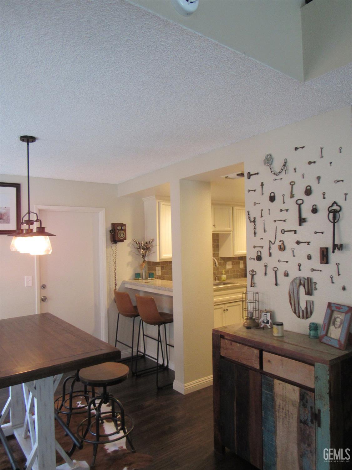 Undisclosed Address Bakersfield, CA 93309 - Photo 4 of 25 a view of a kitchen with a table and chairs