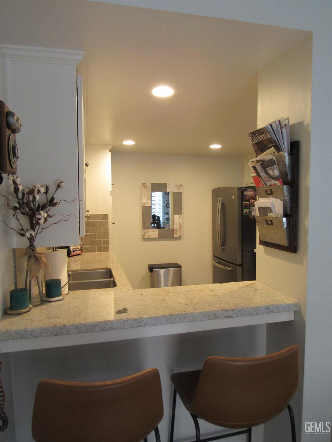 Undisclosed Address Bakersfield, CA 93309 - Photo 7 of 25 a bathroom with a sink and a mirror