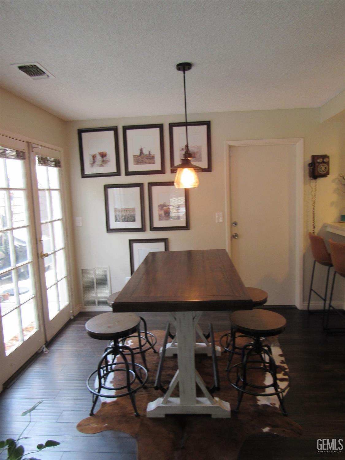 Undisclosed Address Bakersfield, CA 93309 - Photo 9 of 25 a living room with furniture a window and gym equipment