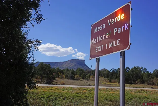 a view of a street with a building in the background