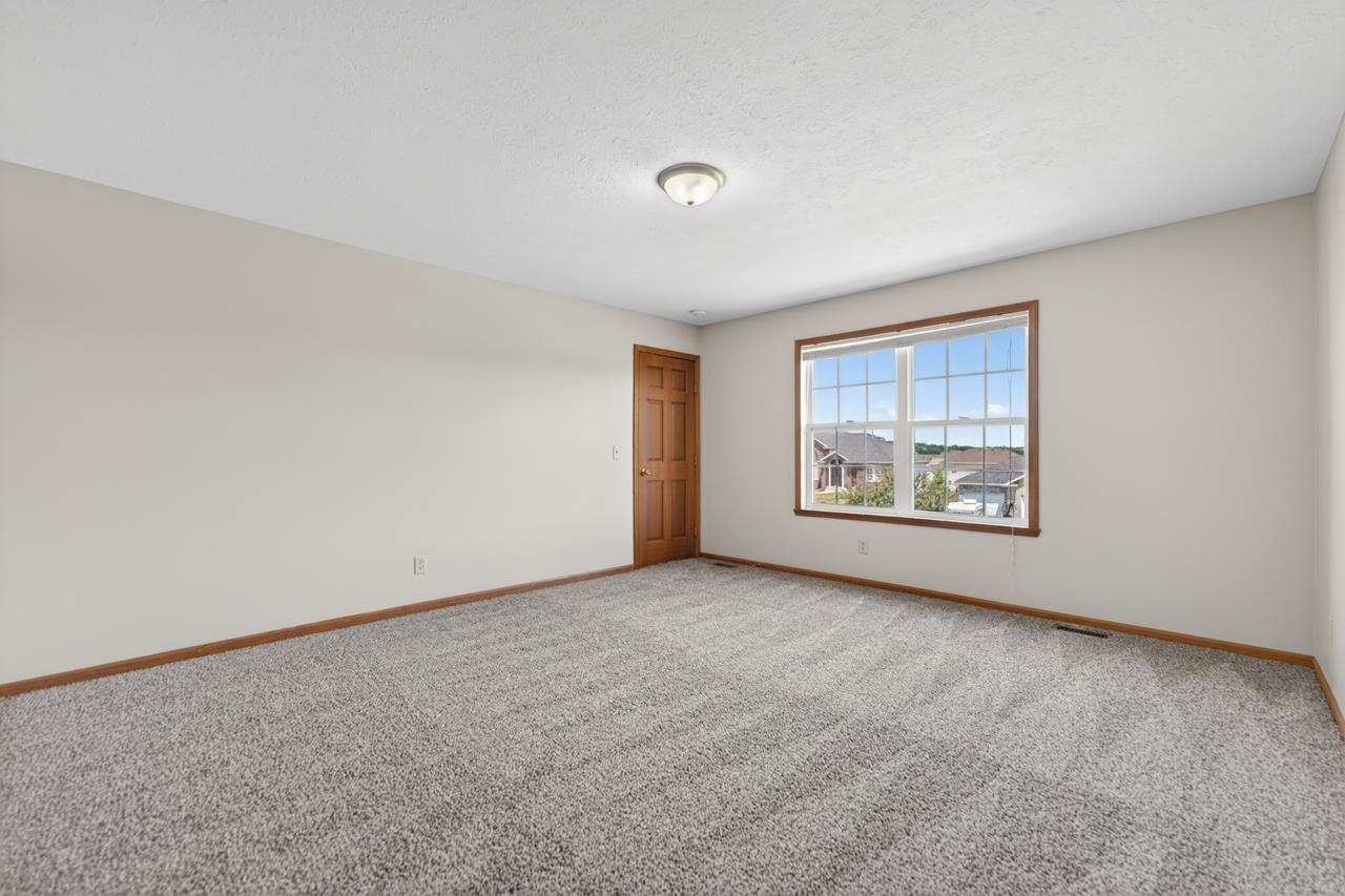 676 Elberon Way Roscoe, IL 61073 - Photo 18 of 30 a view of an empty room with a window