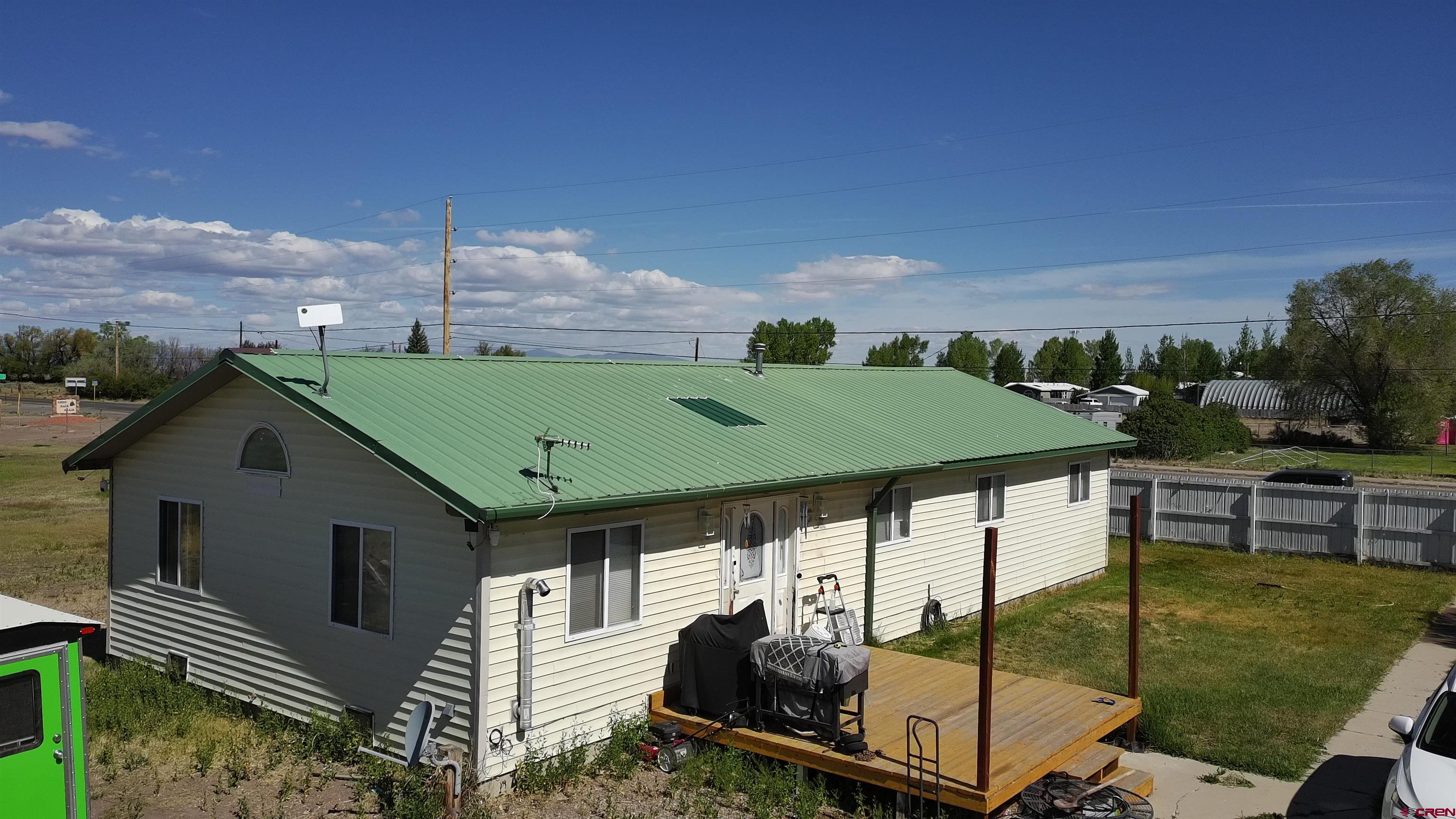 816 Main Street Manassa, CO 81141 - Photo 5 of 23 a view of a balcony with two chairs and a table