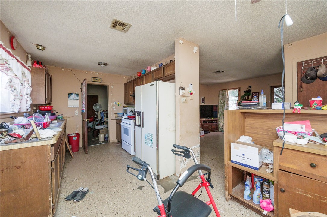 1007 Ross Street George West, TX 78022 - Photo 11 of 24 a view of a room with storage and utility