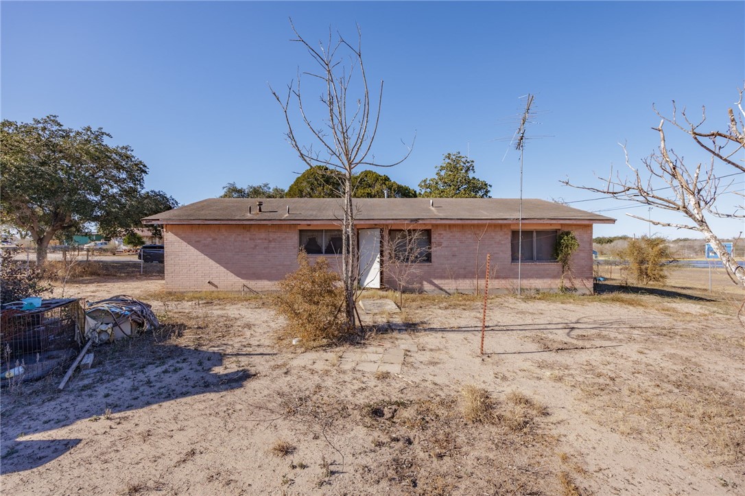 1007 Ross Street George West, TX 78022 - Photo 22 of 24 a front view of a house with a yard