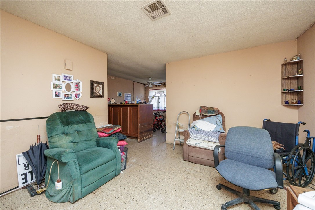 1007 Ross Street George West, TX 78022 - Photo 8 of 24 a living room with furniture and a couch
