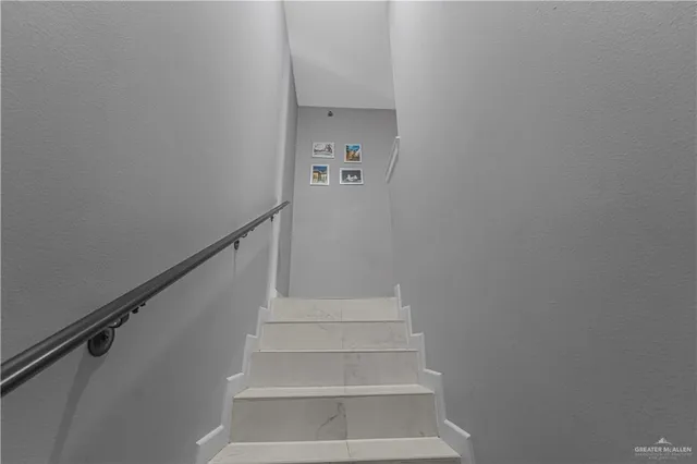 a living room with furniture and a dining table with wooden floor