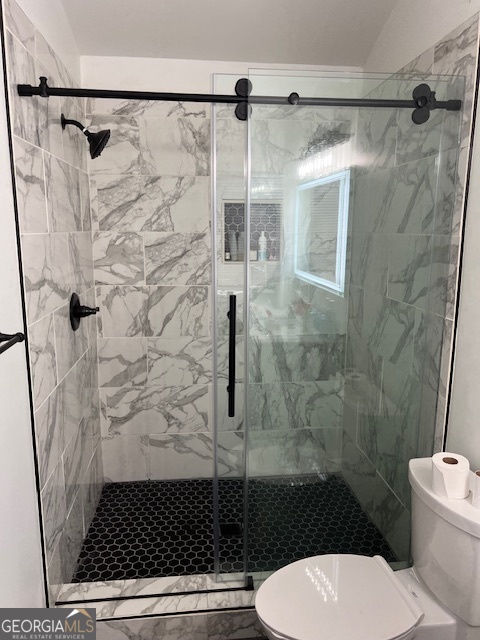 2026 Austin Park Circle Decatur, GA 30032 - Photo 22 of 32 a bathroom with a toilet and a shower