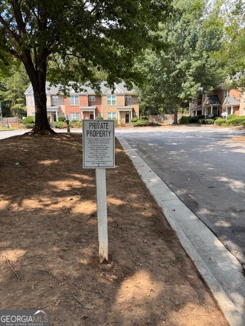 2026 Austin Park Circle Decatur, GA 30032 - Photo 4 of 32 a street sign on a sidewalk next to a road