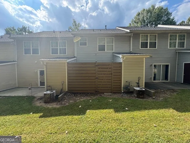 a view of a brick house with a yard