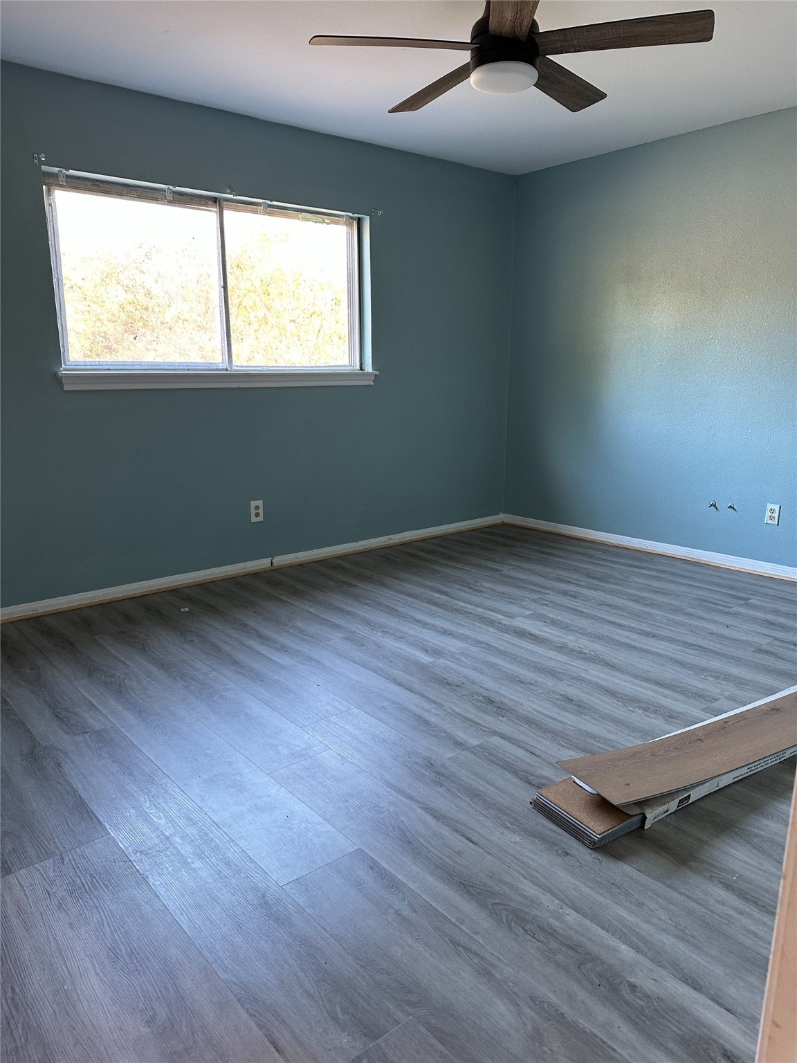 1011 Whitestone Lane Houston, TX 77073 - Photo 22 of 32 an empty room with wooden floor and windows