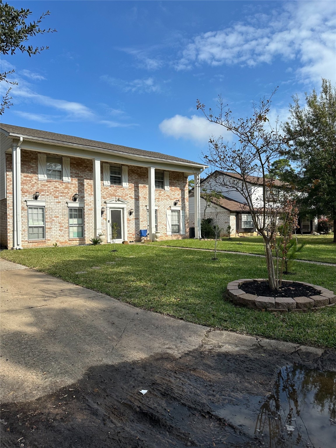 1011 Whitestone Lane Houston, TX 77073 - Photo 3 of 32 a front view of a house with a garden